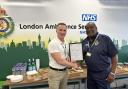 Noel Thomas receives his certificate from Chief Executive Jason Killens