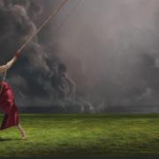 The album cover features Raye under a dark cloud in a contrasting red dress.