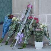 Floral tributes left near Syward Place in Chertse after the death of a two-year-old girl in Surrey