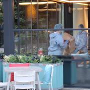 Forensic police collecting an item from Remoli Wembley Park