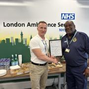 Noel Thomas receives his certificate from Chief Executive Jason Killens