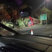 A person has been taken to hospital following a bus crash in west London